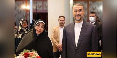 لنقلب صفحات التاریخ: غبار الحزن والفراق یکسو وجه زوجه وابن الشهید أمیر عبد اللهیان فی مؤتمر دولی + صور