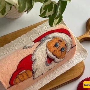 إبداع مذهل للفنان قنّاد فی صنع کعکه رول سانتا کلوز الممیزه