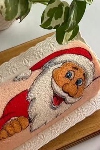 إبداع مذهل للفنان قنّاد فی صنع کعکه رول سانتا کلوز الممیزه