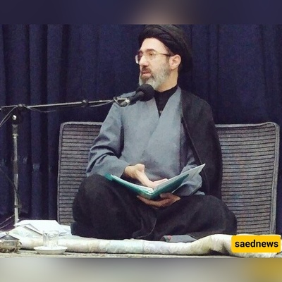 صوره لافته لأحفاد مرشد الثوره الإیرانیه فی حضن والدهم: الابن بزی الحرس الثوری والبنت ترتدی الحجاب الکامل