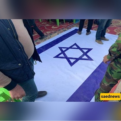 بصوره تثیر إعجاب الملایین: عندما سحق الإمام الخامنئی الکیان الصهیونی بخطوه واحده — صوره للعلم الإسرائیلی تحت قدم قائد الثوره تتصدر وسائل التواصل