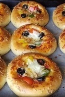 الطبخ السریع والسهل: کیفیه صنع البیتزا الصغیره اللذیذه فی المنزل + فیدیو